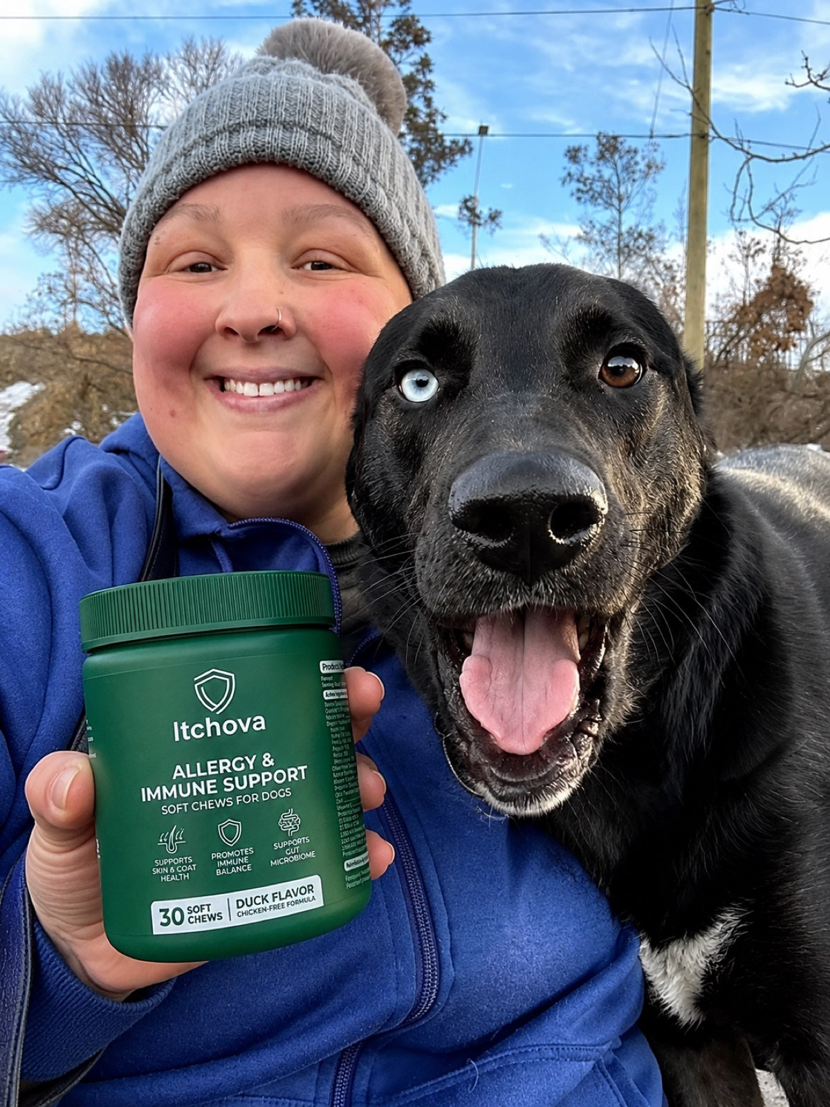 Dog parent outdoors with her dog and an Itchova jar